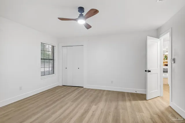 a view of a balcony with wooden floor