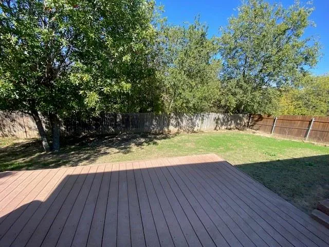 a view of a backyard with wooden floor