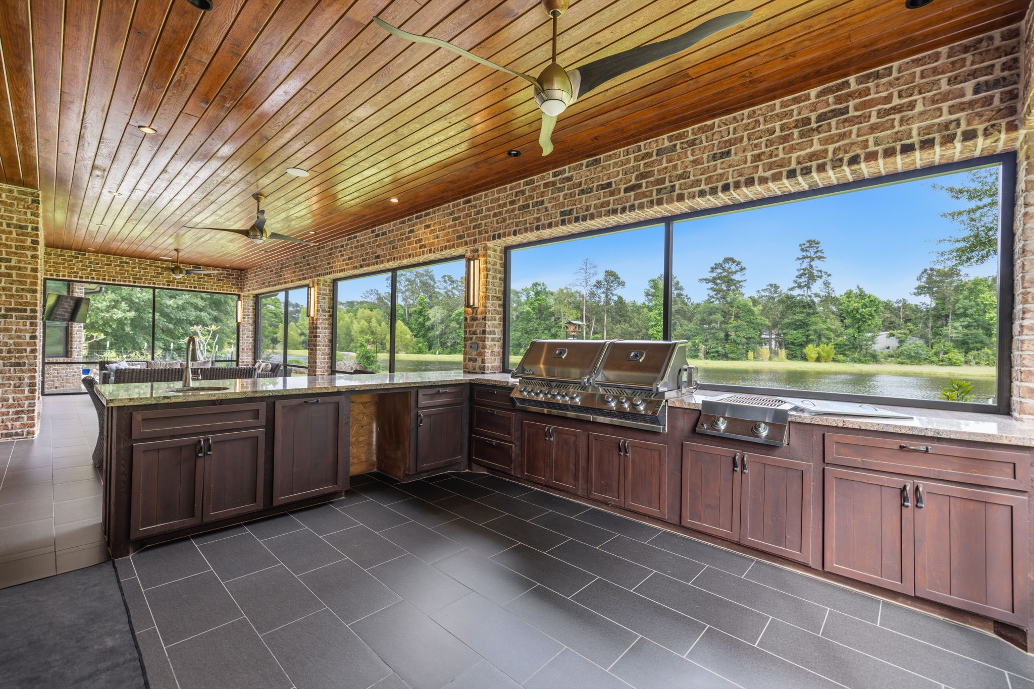 6918 Comanche Bend Montgomery, TX 77316 - Photo 5 of 50 The outdoor spaces make you feel like you’re on vacation every day, with picture-perfect screened-in windows overlooking your beautiful waterfront lot.