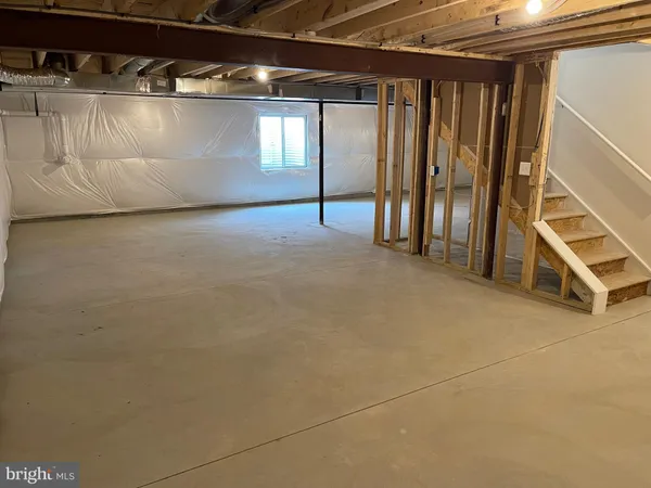 a view of an empty room with stairs