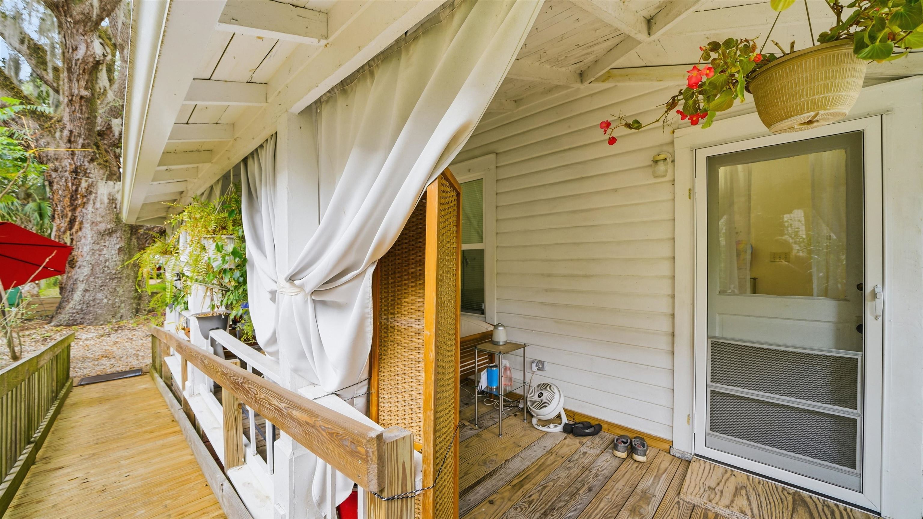 15 Davis Street St. Augustine, FL 32084 - Photo 29 of 48 a view of a balcony with wooden floor and door