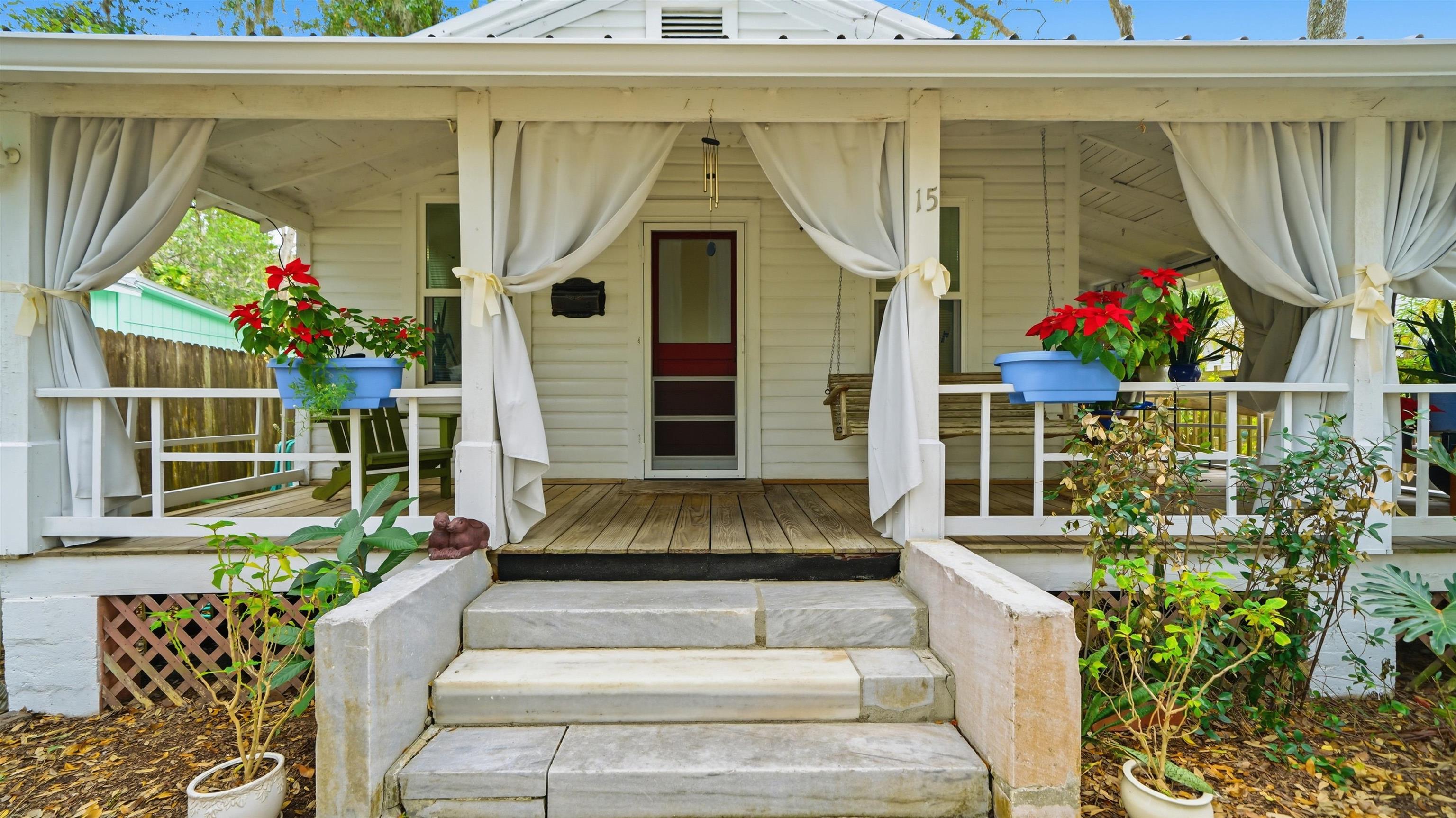 15 Davis Street St. Augustine, FL 32084 - Photo 4 of 48 a front view of a house with a porch