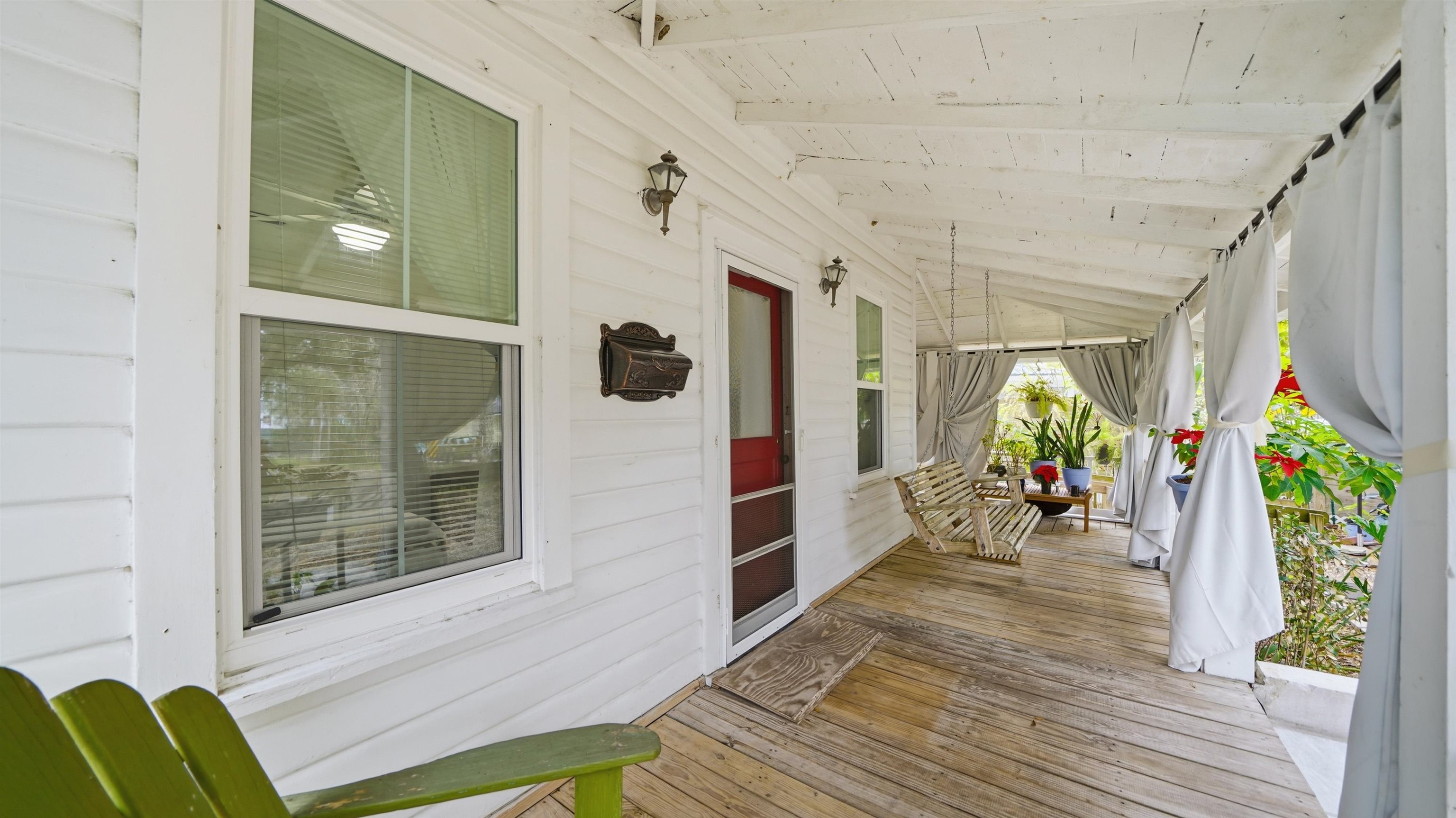 15 Davis Street St. Augustine, FL 32084 - Photo 5 of 48 a view of a hallway with wooden floor and windows