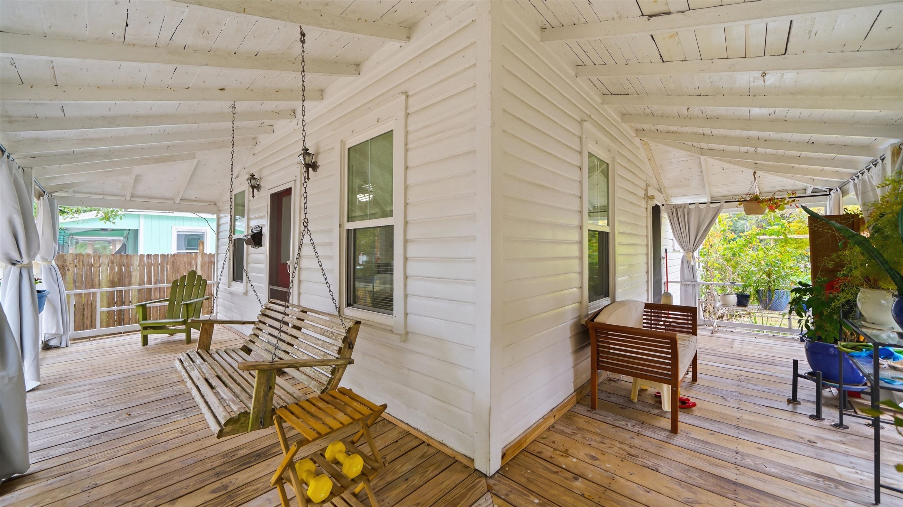 15 Davis Street St. Augustine, FL 32084 - Photo 7 of 48 a balcony with chairs and wooden floor