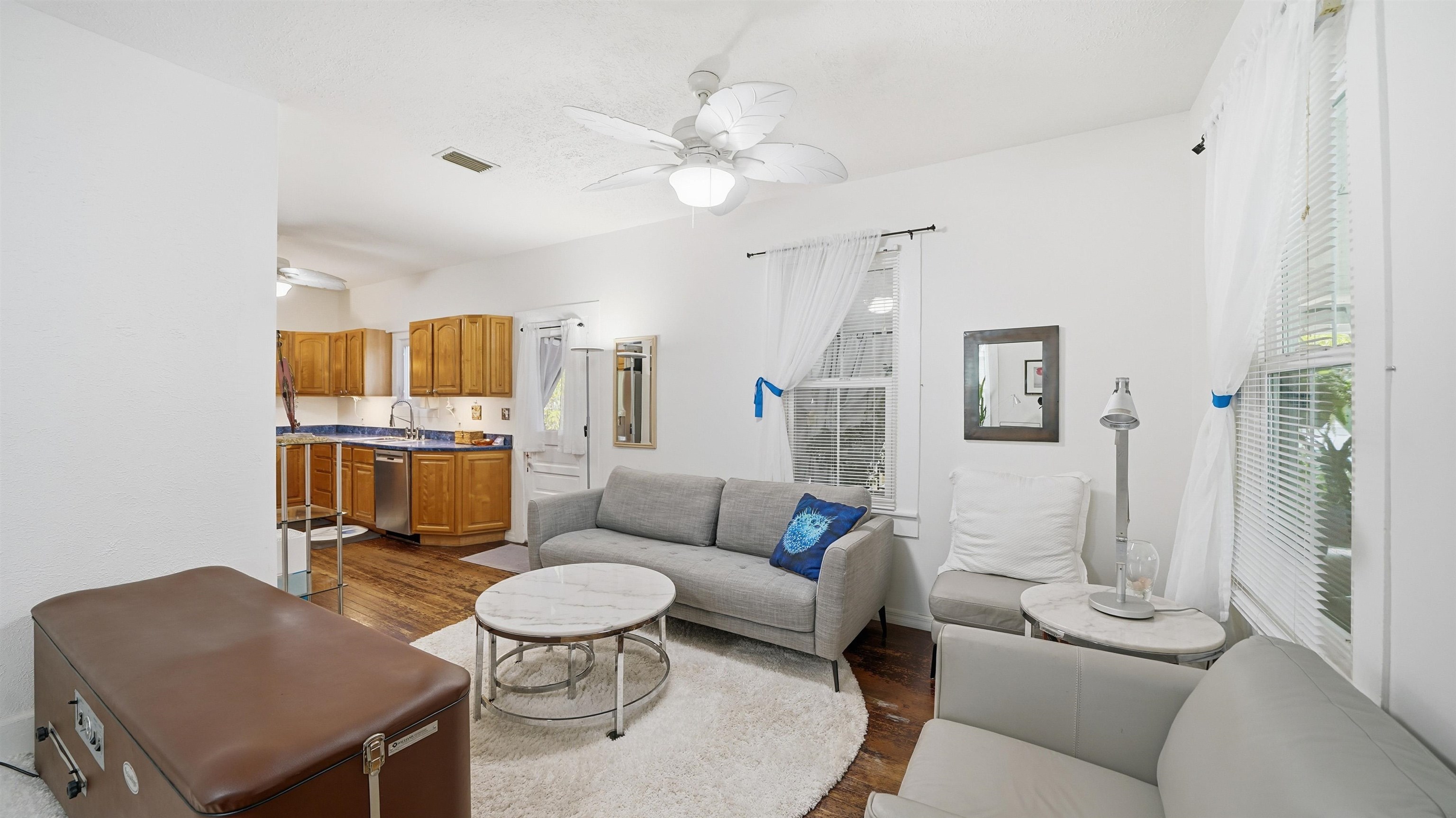 15 Davis Street St. Augustine, FL 32084 - Photo 8 of 48 a living room with furniture and a chandelier
