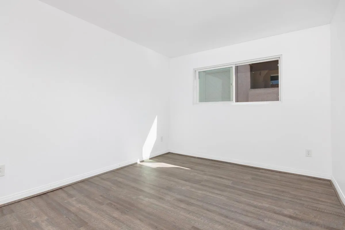3431 Capalina Road, Unit 16 San Marcos, CA 92069 - Photo 11 of 17 a view of an empty room with wooden floor