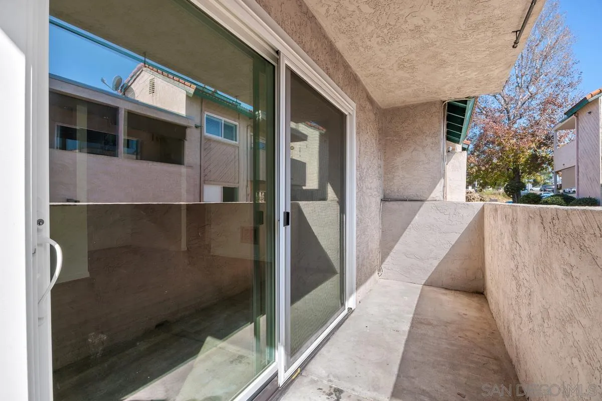 3431 Capalina Road, Unit 16 San Marcos, CA 92069 - Photo 17 of 17 a view of a brick house with a large windows
