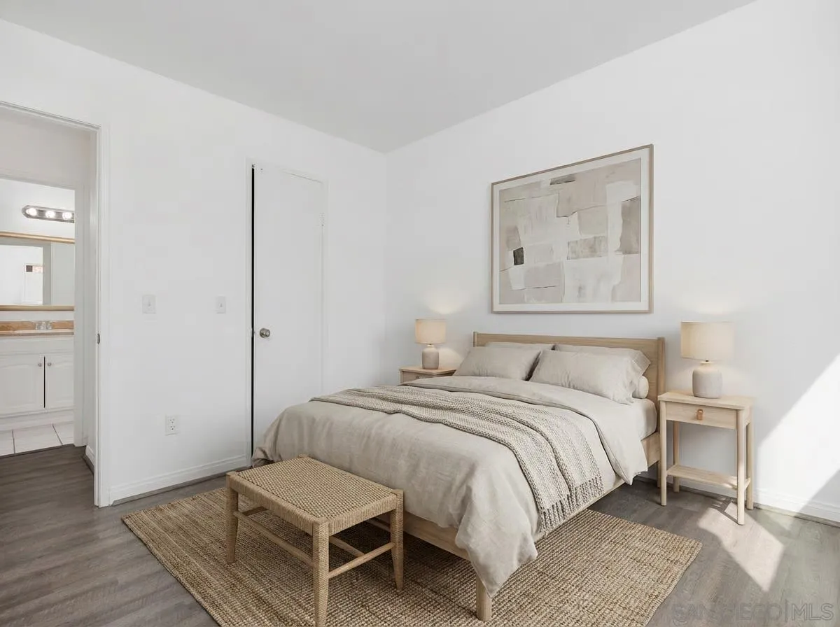 3431 Capalina Road, Unit 16 San Marcos, CA 92069 - Photo 5 of 17 a bedroom with a bed and a painting on the wall