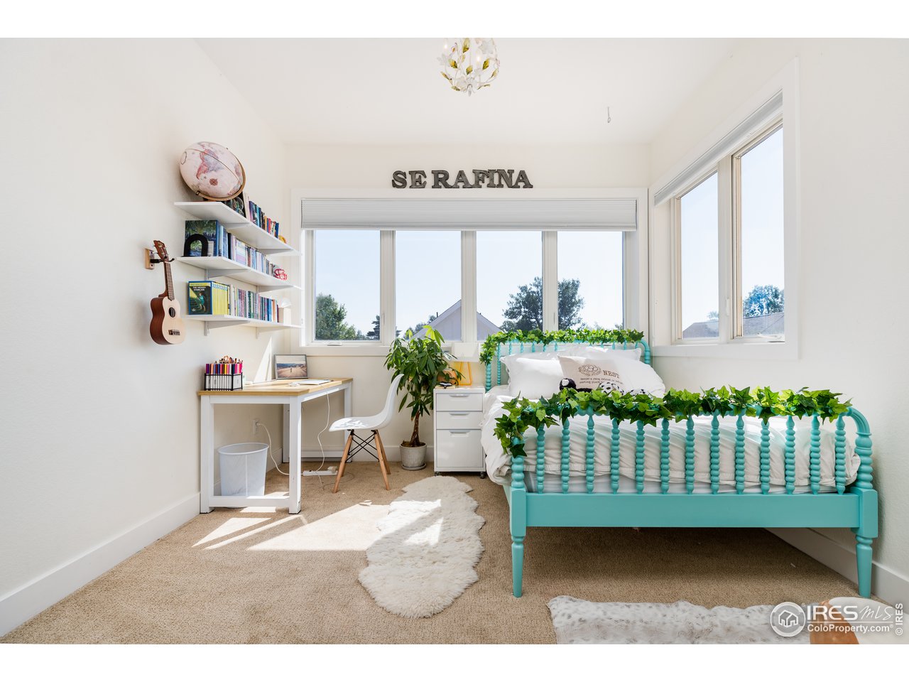 1229 Cedar Avenue Boulder, CO 80304 - Photo 16 of 29 a bedroom with furniture a window and a book self