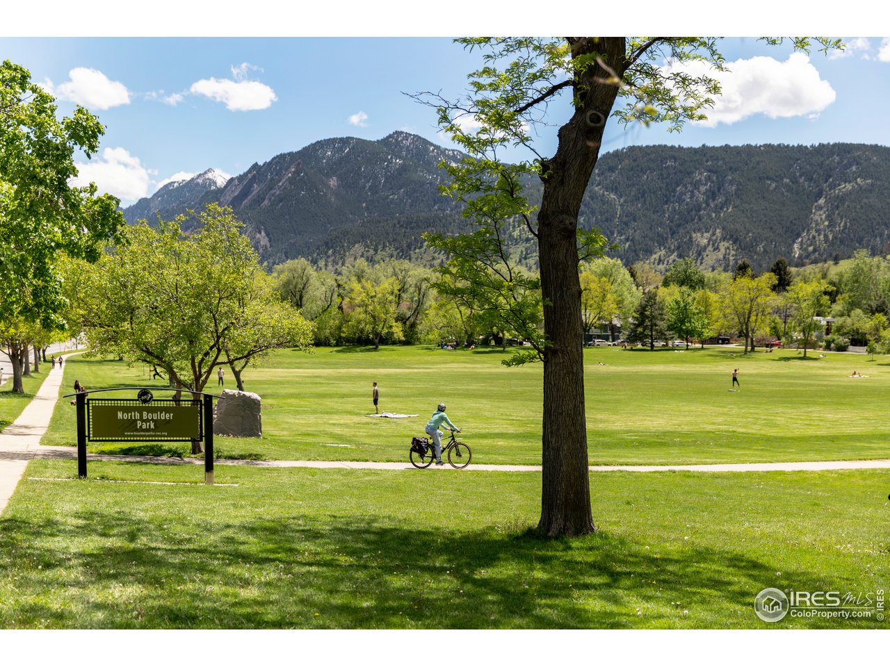 1229 Cedar Avenue Boulder, CO 80304 - Photo 28 of 29 a view of a golf course with a lake view