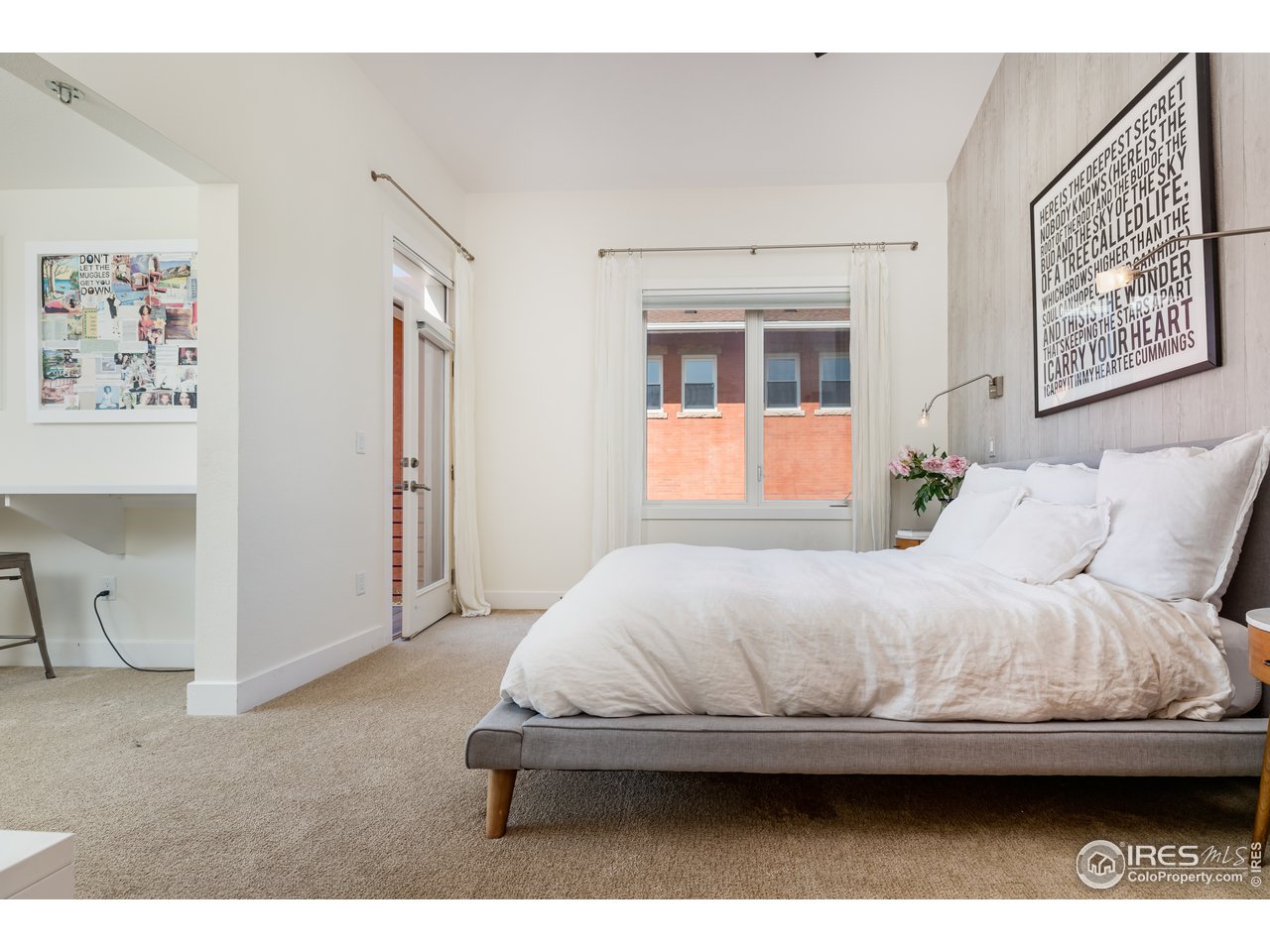 1229 Cedar Avenue Boulder, CO 80304 - Photo 10 of 29 a bedroom with a bed and a painting on the wall