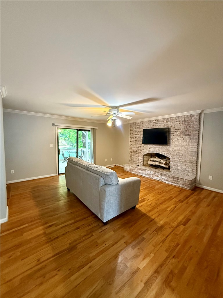 1200 Loran Pointe Circle Seneca, SC 29672 - Photo 22 of 29 This inviting living area boasts rich hardwood floors and a cozy fireplace, perfect for relaxation.