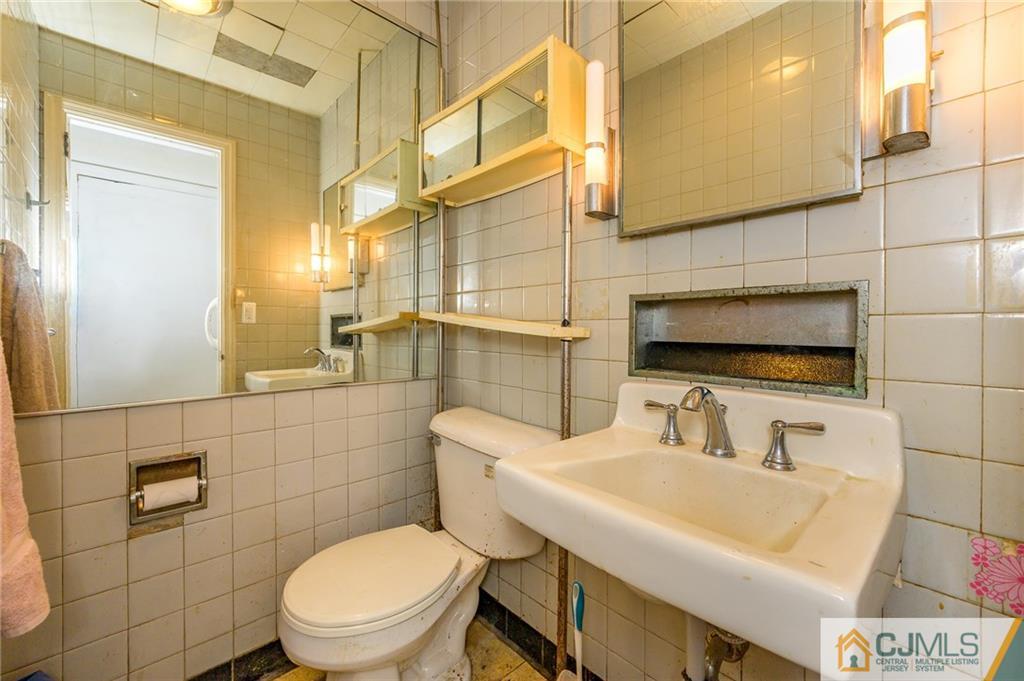 185 Carter Road Princeton, NJ 08540 - Photo 13 of 21 a bathroom with a sink a toilet and mirror