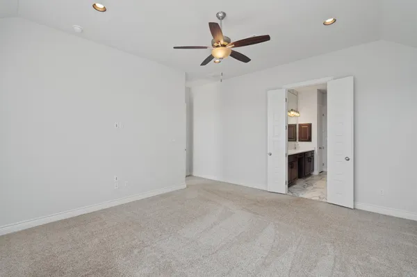 a kitchen with granite countertop kitchen island stainless steel appliances a sink stove and refrigerator