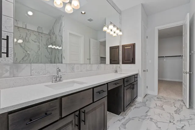 an empty room with closet and windows