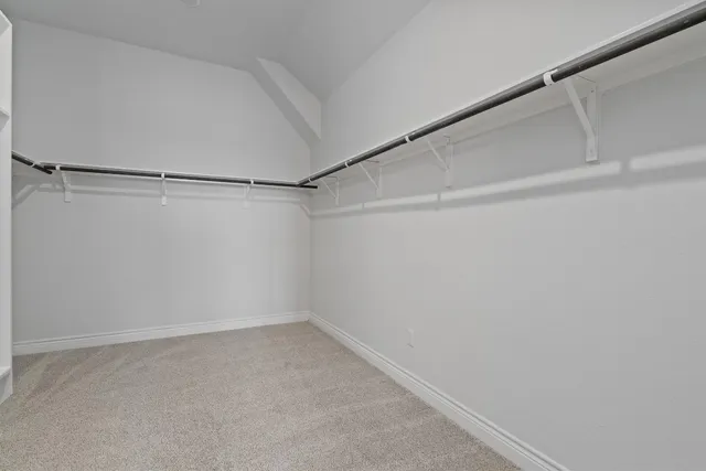 a bathroom with a sink double vanity granite and a shower