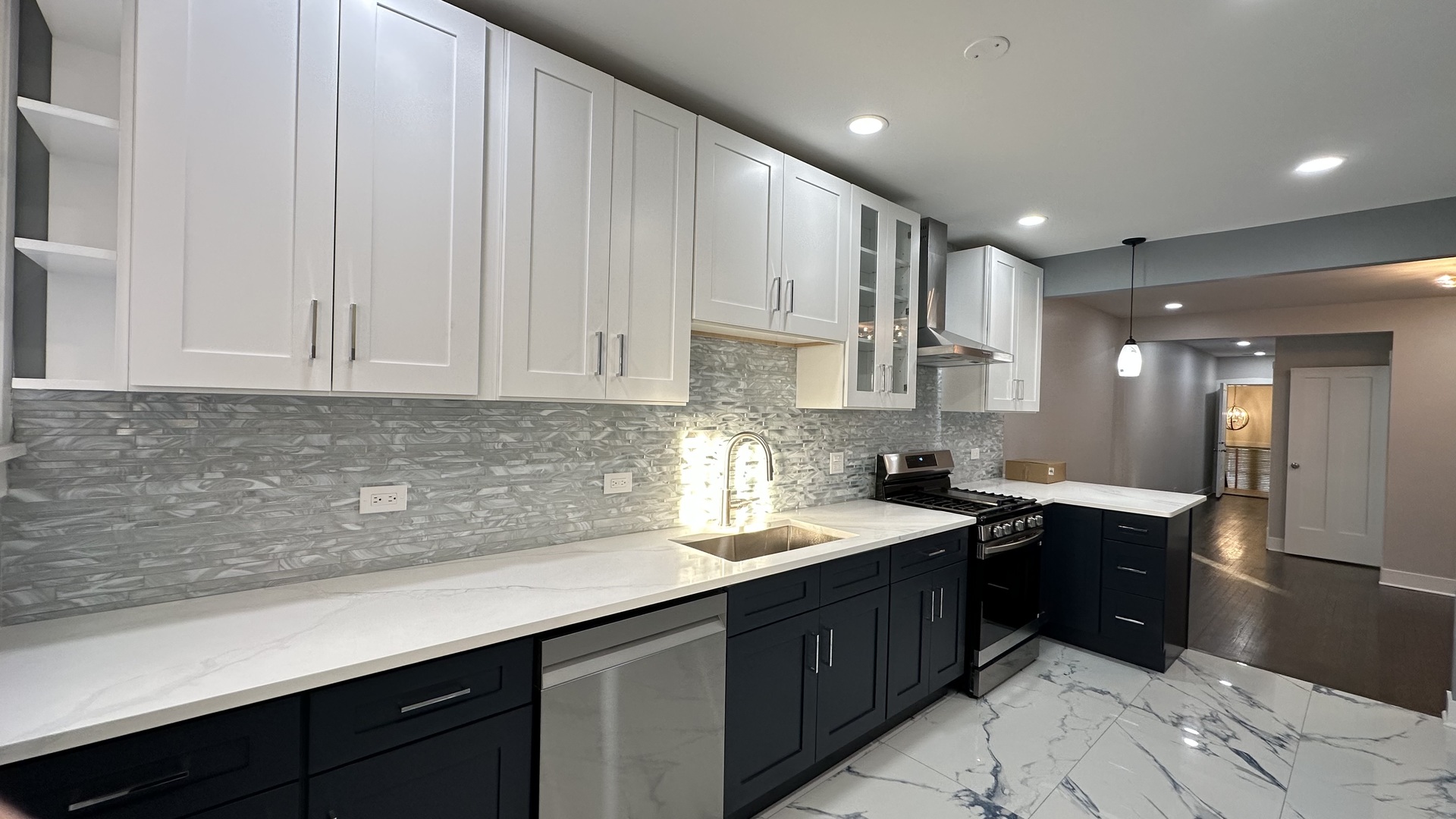 5224 North Bernard Street, Unit 1 Chicago, IL 60625 - Photo 12 of 13 a kitchen with a sink and cabinets