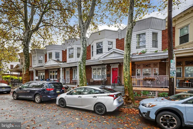 a car parked in front of a houses
