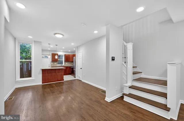 a view of kitchen and wooden floor