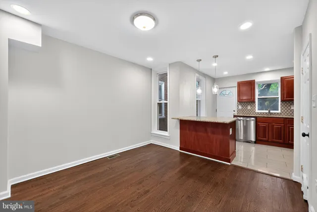 a view of kitchen with wooden floor