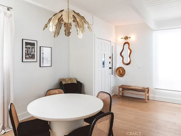 a view of a room that has a table and chairs