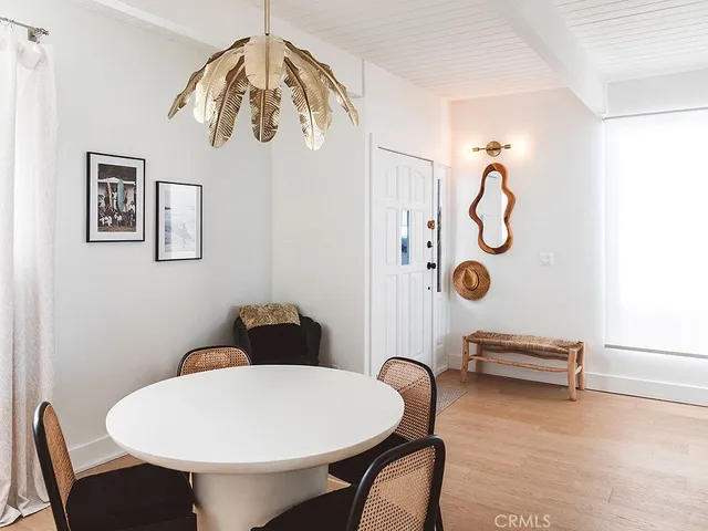 a view of a room that has a table and chairs