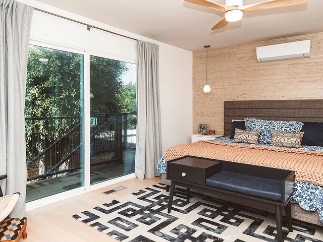 a room with a bed and a window