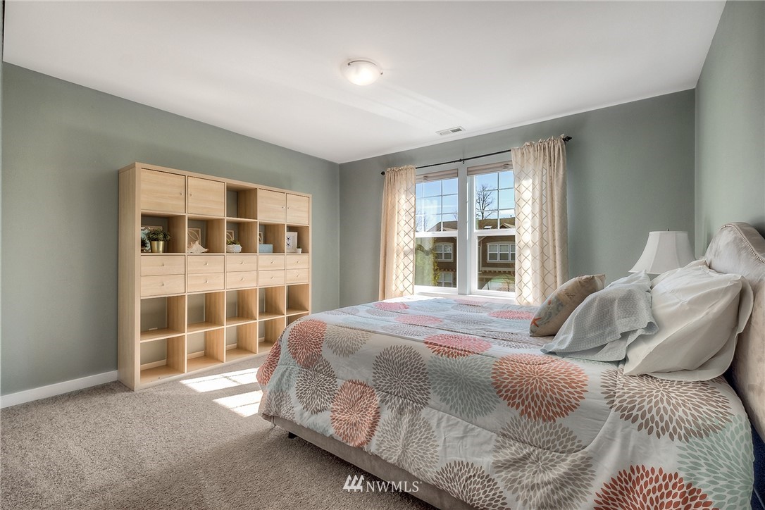 5236 Northeast 9th Place Renton, WA 98059 - Photo 22 of 27 a bedroom with a bed and a window