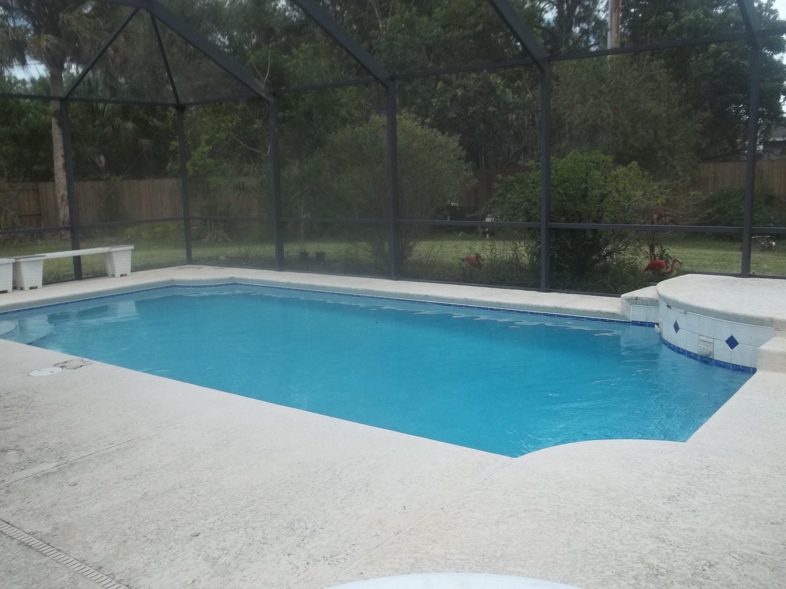 2201 Southwest Cree Road Port St. Lucie, FL 34953 - Photo 3 of 5 Pool and screen enclosure