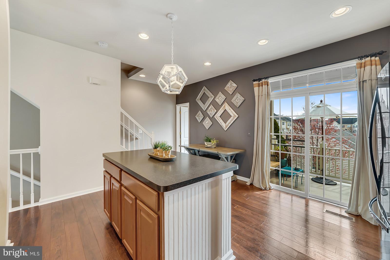 42427 Rockslide Terrace Brambleton, VA 20148 - Photo 31 of 54 Kitchen with Access to Covered Porch / Deck