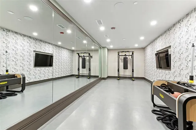 a view of a livingroom with furniture and flat screen tv