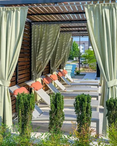 a backyard of a house with outdoor seating
