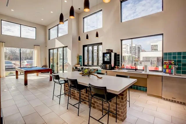 a view of a dining room with furniture and window