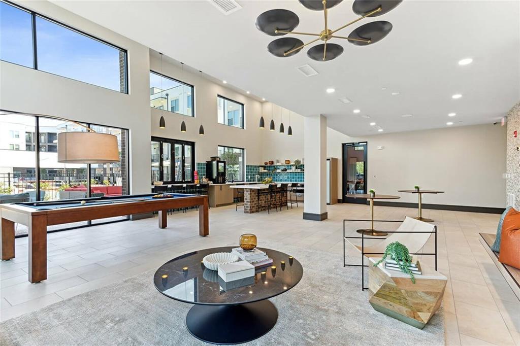 125 Milton Avenue Southeast, Unit S1 Atlanta, GA 30315 - Photo 8 of 41 a living room with furniture and a large window