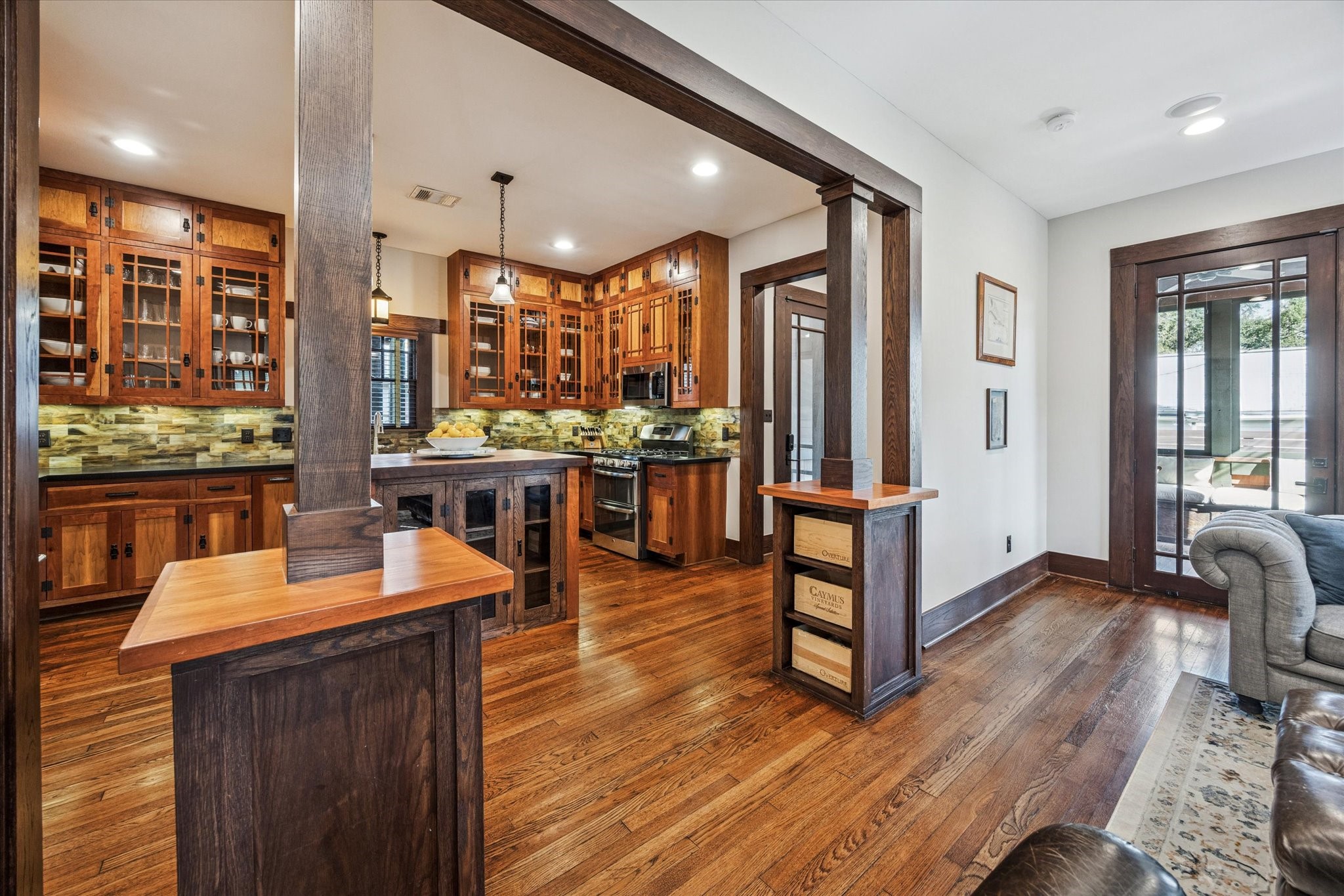 512 Archer Street Houston, TX 77009 - Photo 16 of 40 The craftsman square wood columns with storage define the space from the kitchen to the living room.