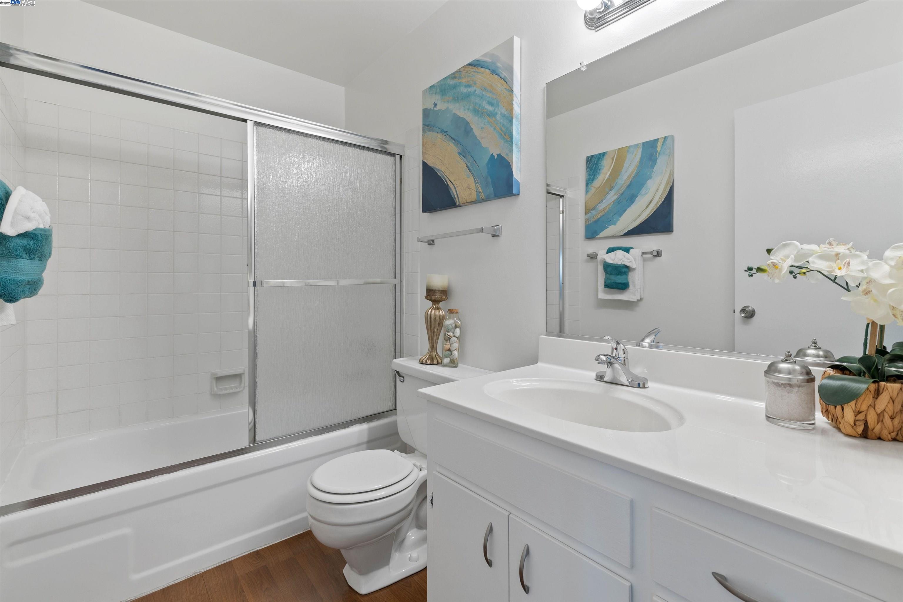 21053 Baker Road Castro Valley, CA 94546 - Photo 15 of 22 a bathroom with a sink toilet and shower