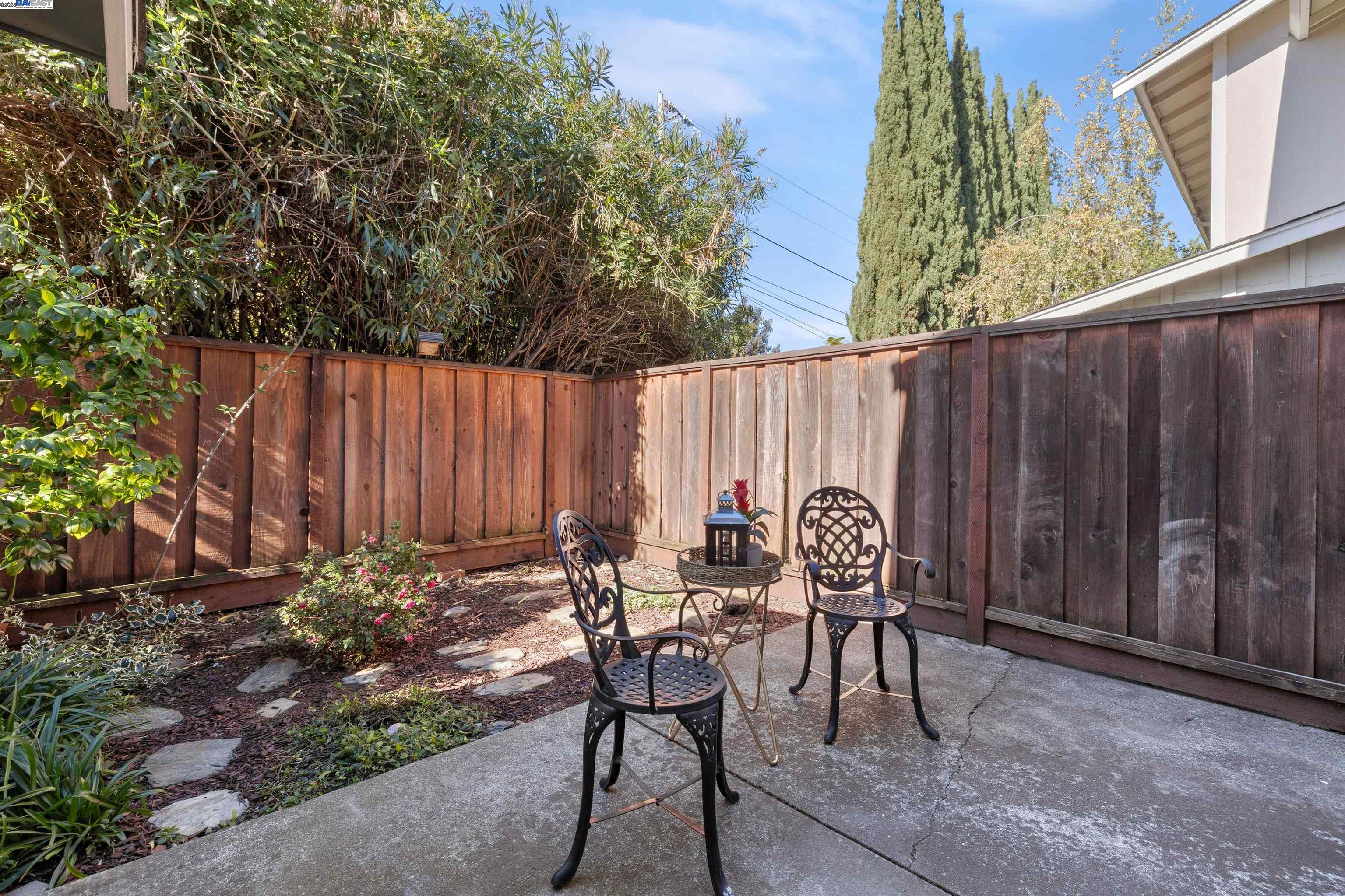 21053 Baker Road Castro Valley, CA 94546 - Photo 17 of 22 a backyard of a house with table and chairs