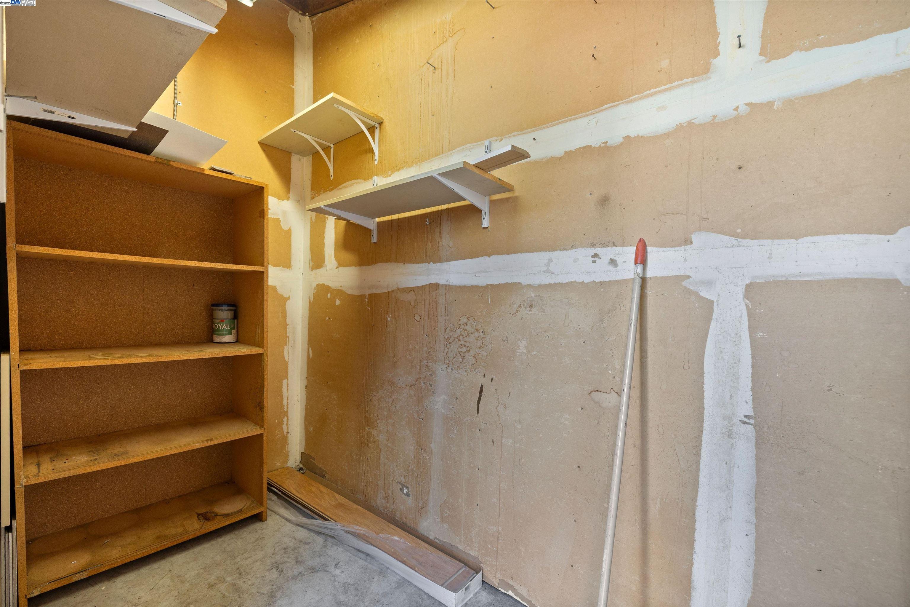 21053 Baker Road Castro Valley, CA 94546 - Photo 19 of 22 a view of walk in closet with empty racks