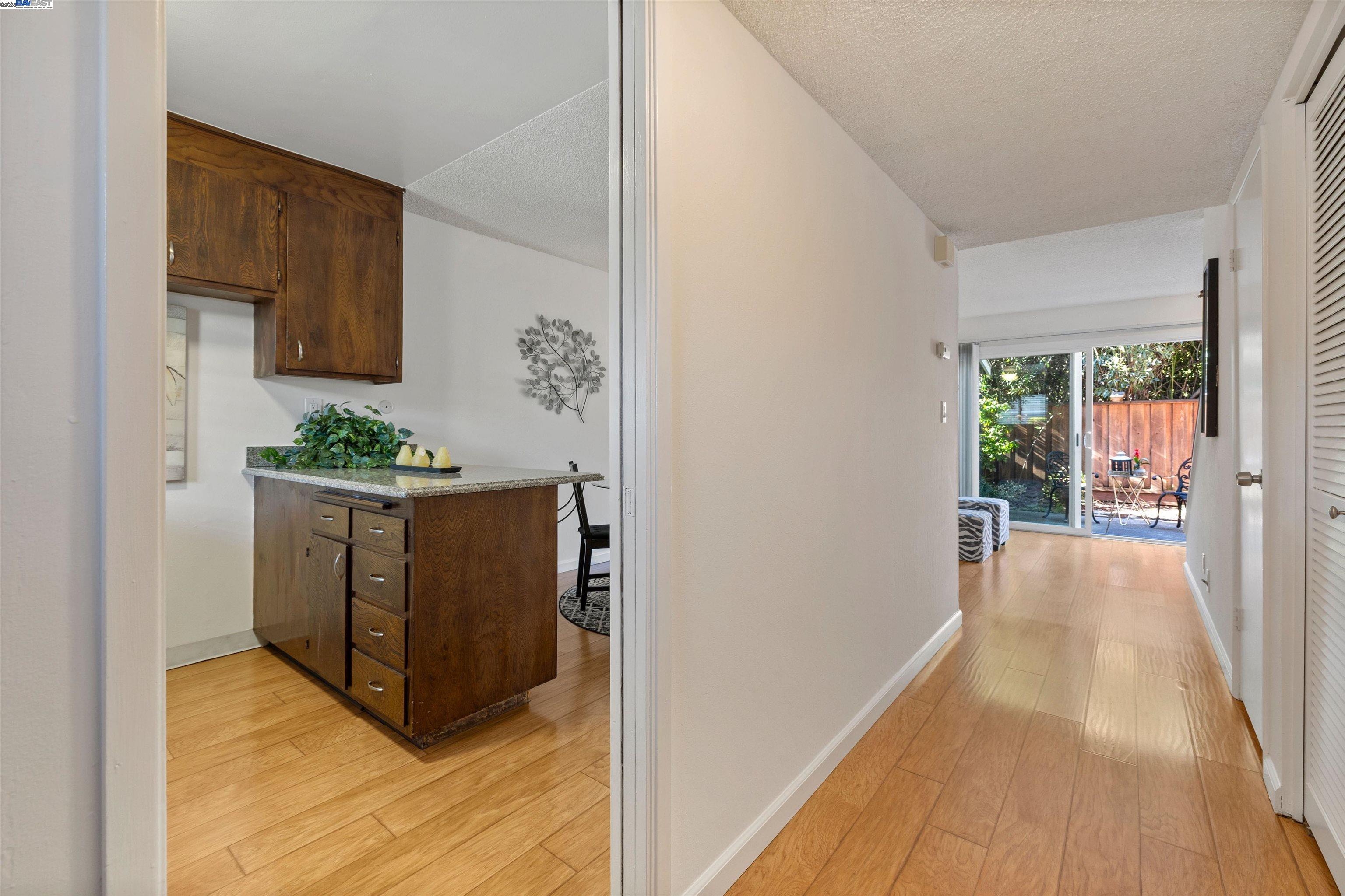 21053 Baker Road Castro Valley, CA 94546 - Photo 2 of 22 a hallway with cabinets and wooden floor