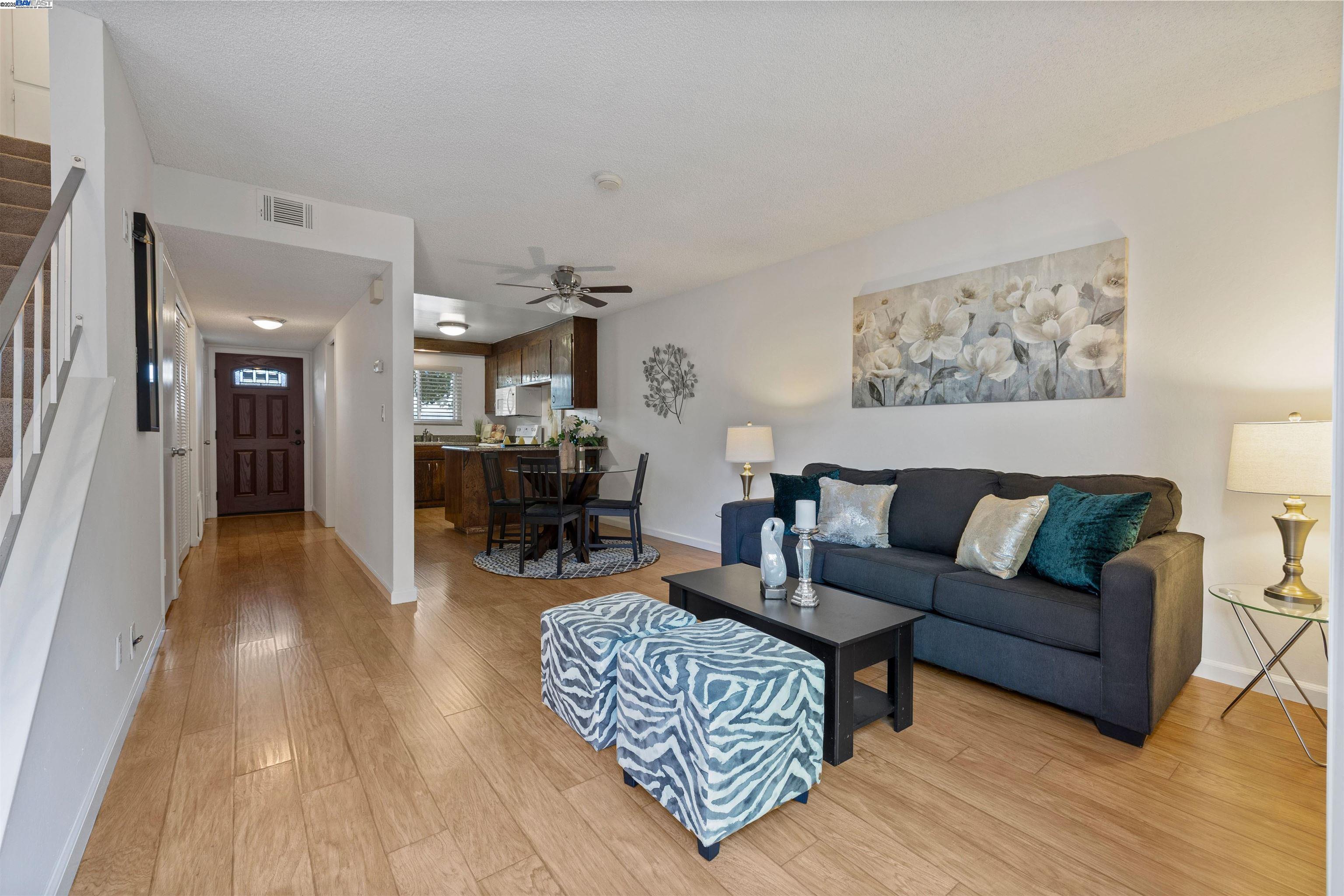 21053 Baker Road Castro Valley, CA 94546 - Photo 3 of 22 a living room with furniture and a wooden floor