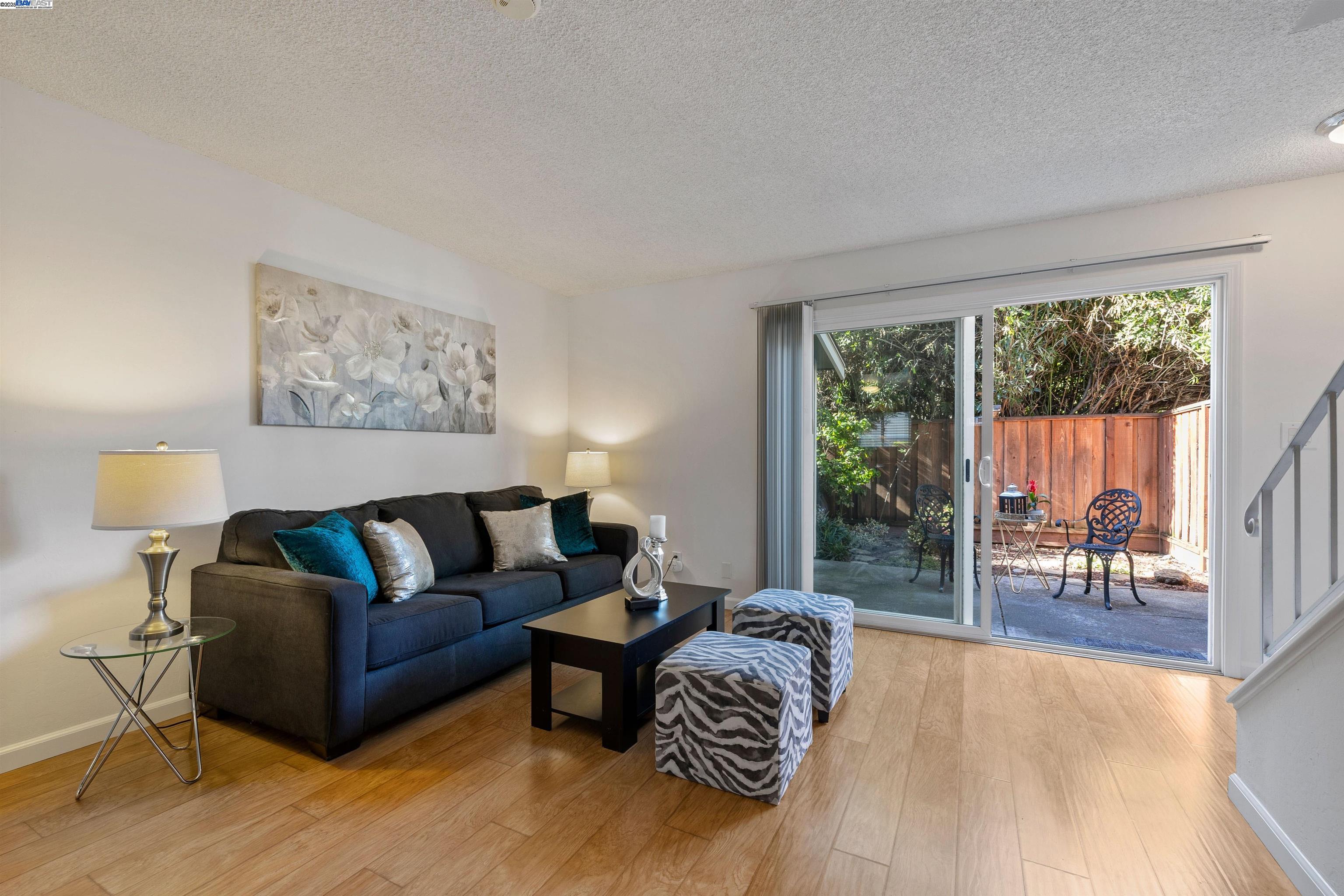 21053 Baker Road Castro Valley, CA 94546 - Photo 4 of 22 a living room with furniture and a large window