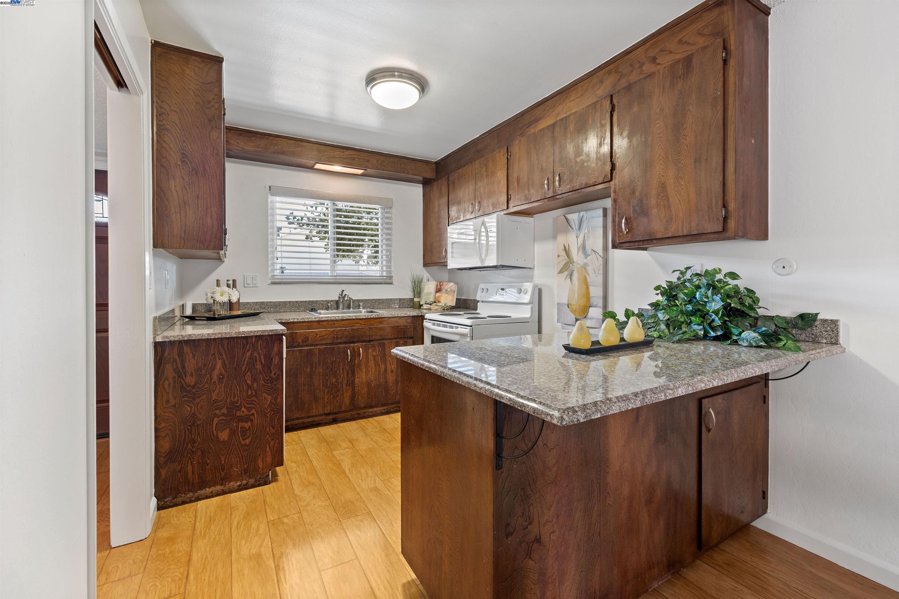 21053 Baker Road Castro Valley, CA 94546 - Photo 6 of 22 a kitchen with stainless steel appliances granite countertop a sink stove and cabinets