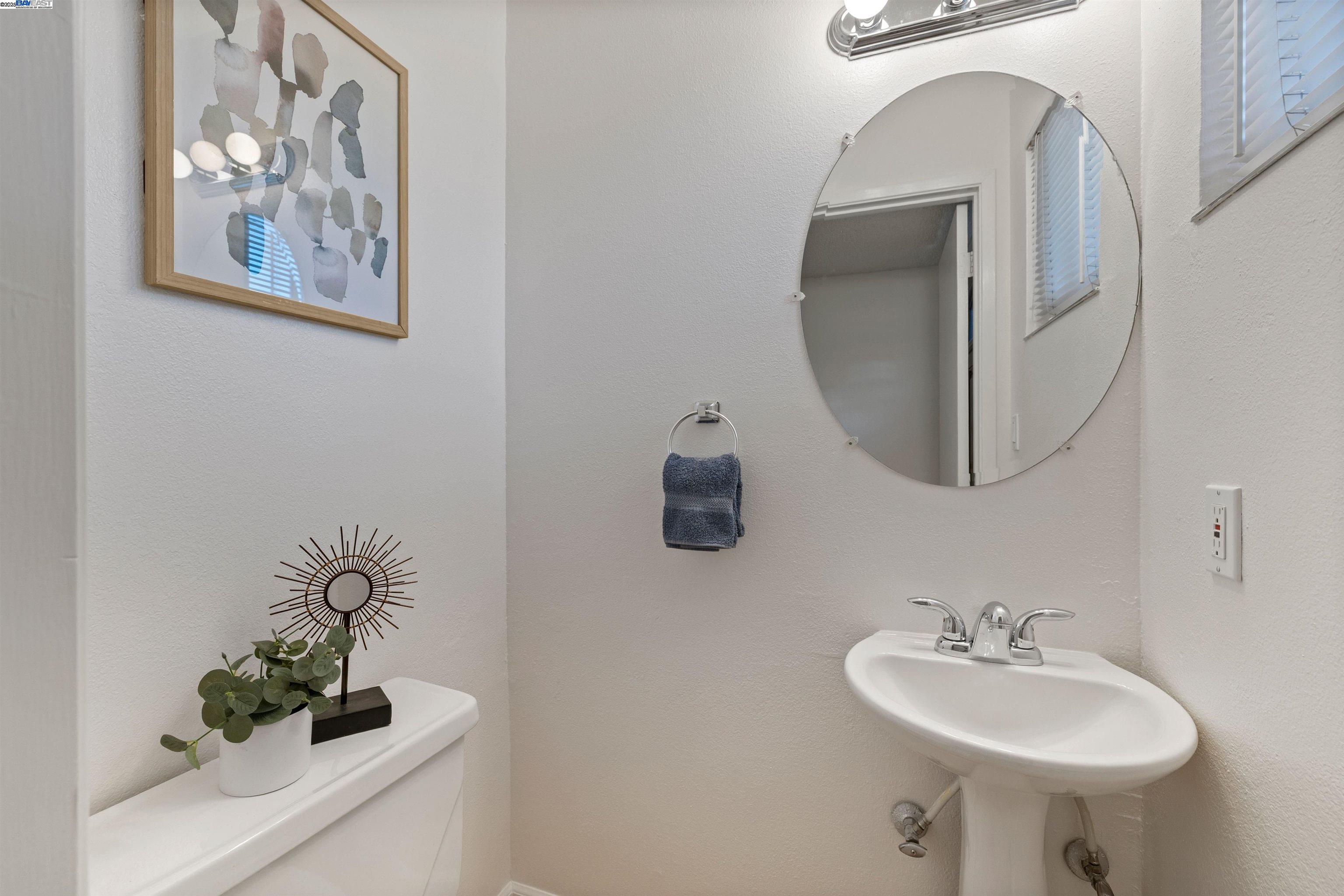 21053 Baker Road Castro Valley, CA 94546 - Photo 8 of 22 a bathroom with a sink and a mirror