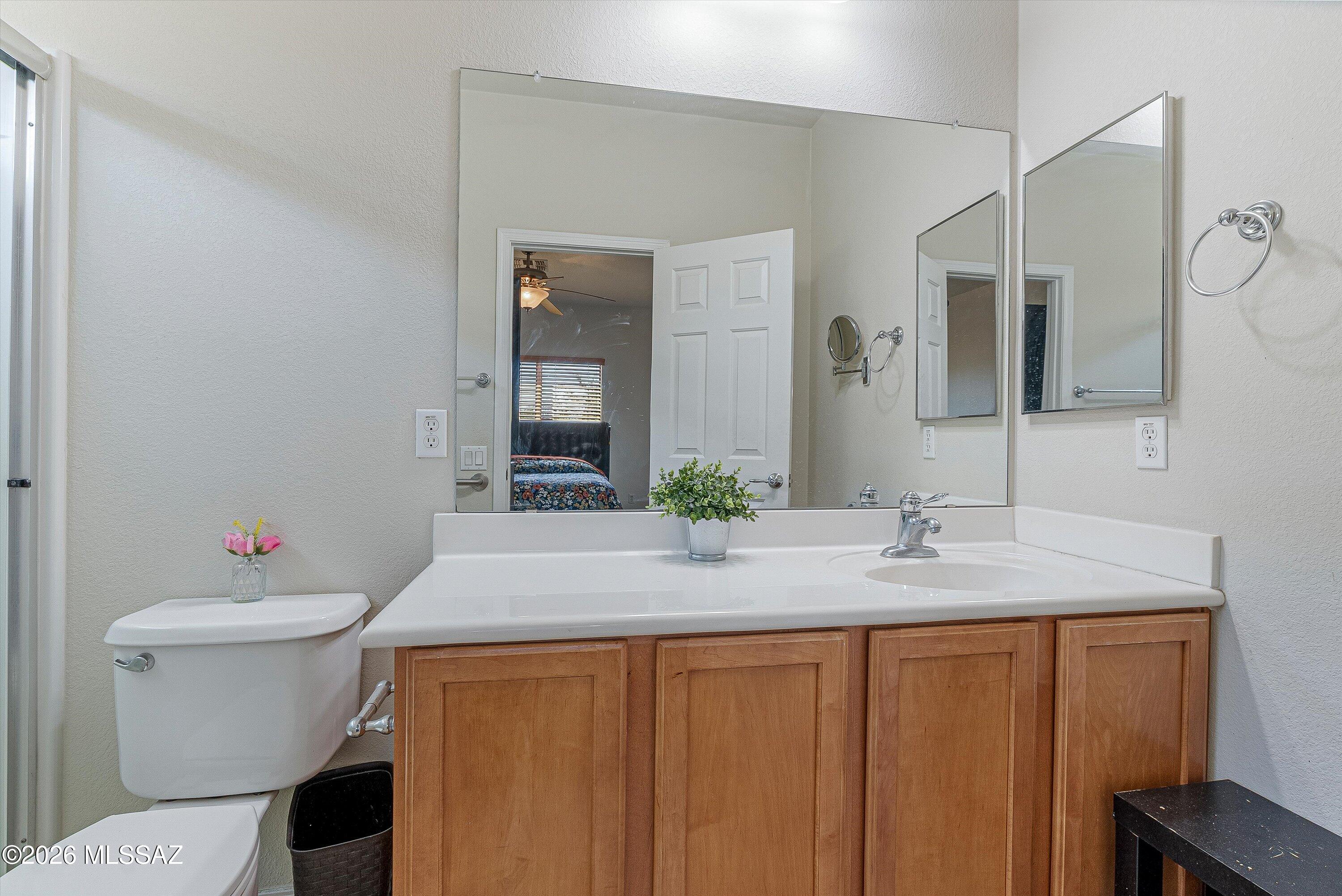 21163 East Treasure Road Red Rock, AZ 85145 - Photo 17 of 35 a bathroom with a granite countertop sink and a mirror