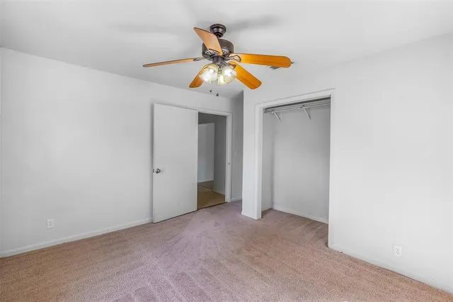 a view of a chandelier fan in a room