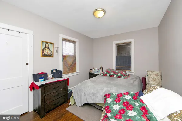 a bedroom with a bed and dresser