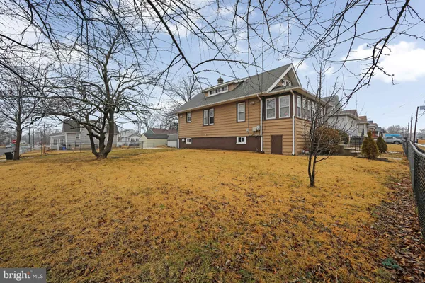 a house that has a tree in front of it