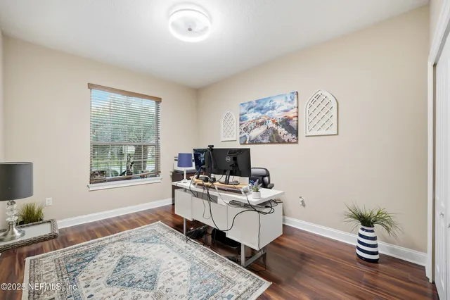 a workspace with furniture and window