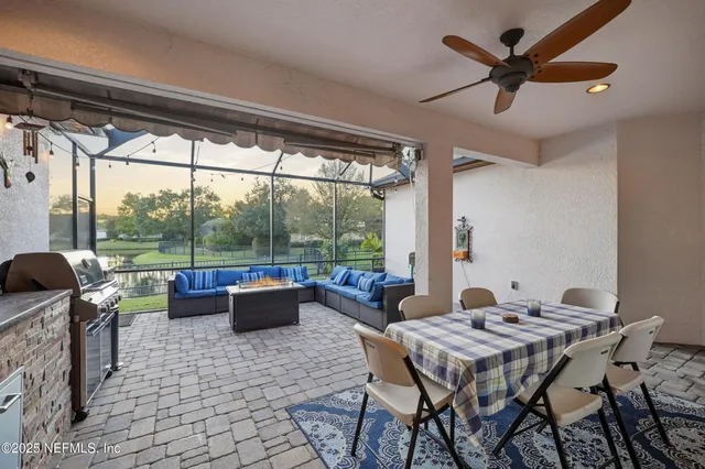 a view of an outdoor dining space with a table and chairs