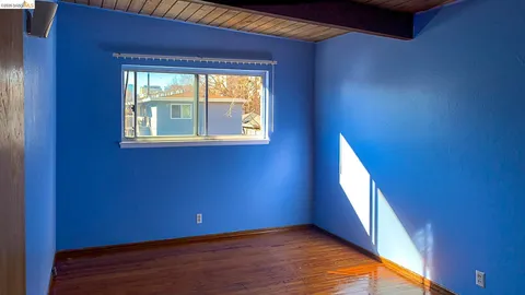 a view of a bathroom with a sink and a mirror